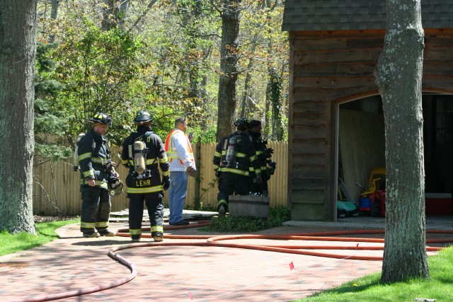 Firefighters at work during Mothers Day House Fire