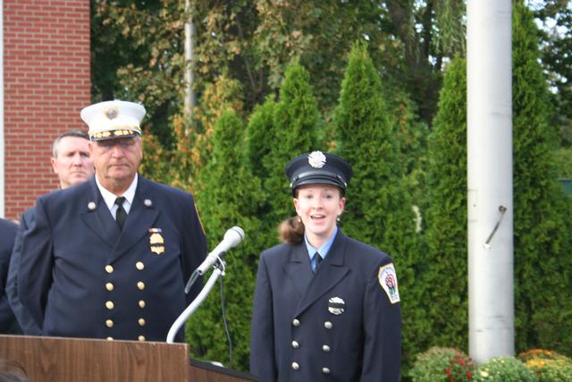 Center Moriches Fire Department Probationary Firefighter Maria Warner singing "God Bless America"
